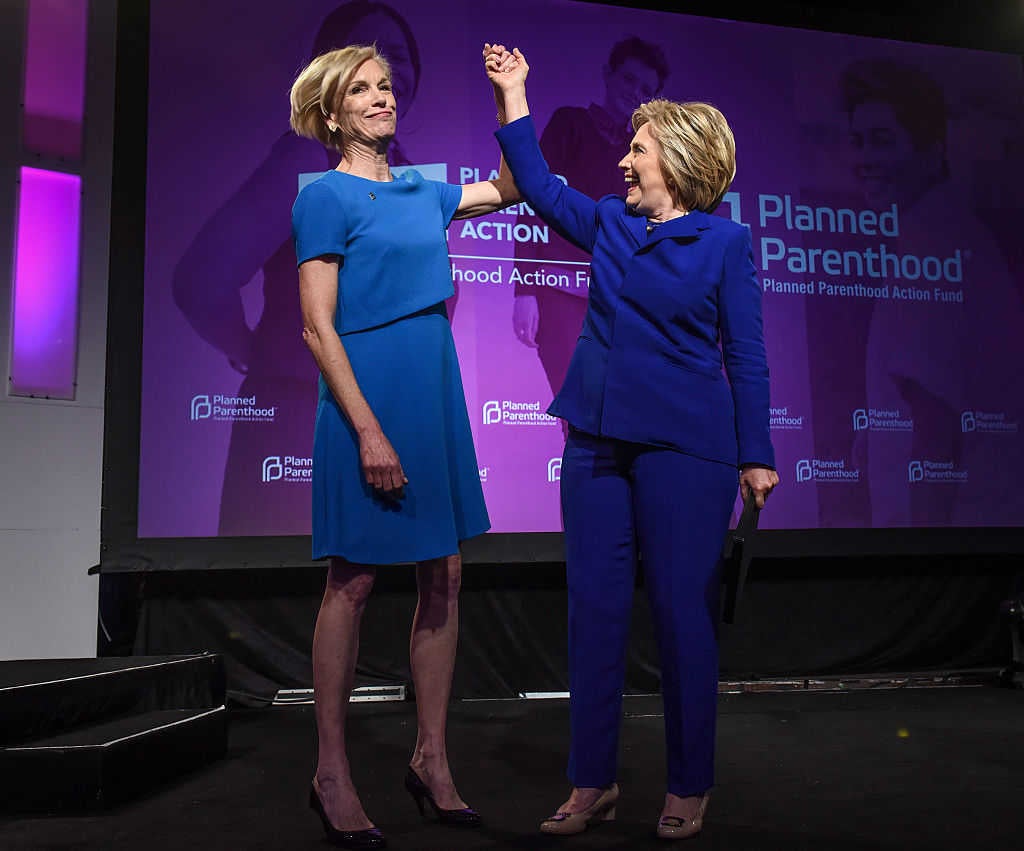 Hillary Clinton, right, is joined onstage by Cecile Richards, left, President of Planned Parenthood (Photo by Bill O'Leary/The Washington Post via Getty Images)