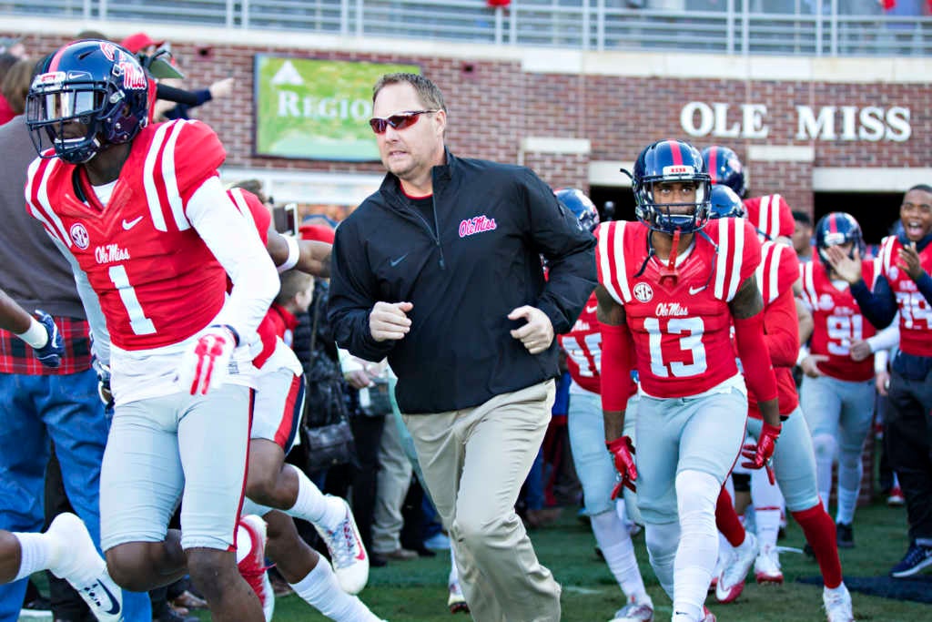 Head Coach Hugh Freeze of the Mississippi Rebels leads his team onto the field before a game against the Mississippi State Bulldogs at Vaught-Hemingway Stadium (Photo by Wesley Hitt/Getty Images)
