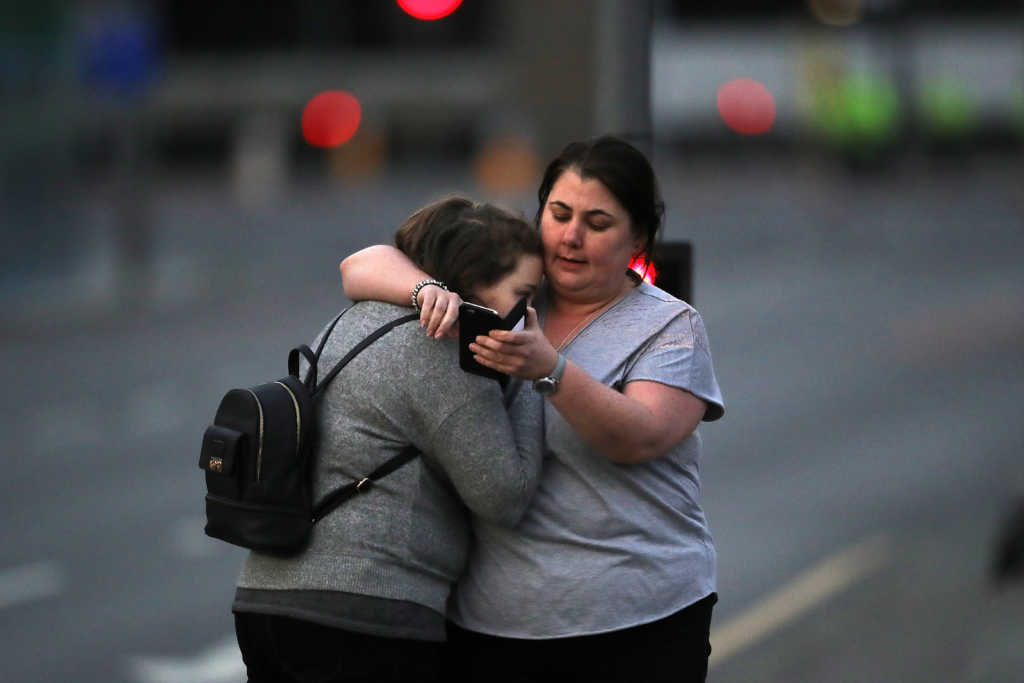 MANCHESTER, ENGLAND - MAY 23: Ariana Grande concert attendees Vikki Baker and her daughter Charlotte, aged 13, leave the Park Inn where they were given refuge after last night's explosion at Manchester Arena on May 23, 2017 in Manchester, England. An explosion occurred at Manchester Arena as concert goers were leaving the venue after Ariana Grande had performed. Greater Manchester Police have confirmed 19 fatalities and at least 50 injured. (Photo by Christopher Furlong/Getty Images)