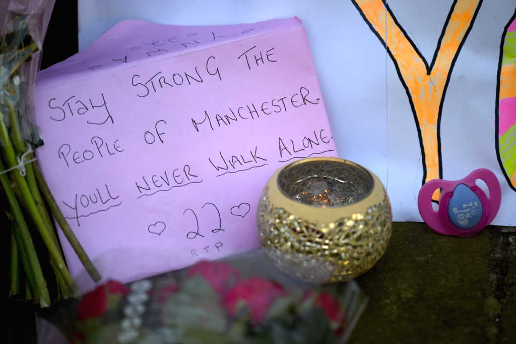 MANCHESTER, ENGLAND - MAY 23: Messages are left amongst tributes left by members of the public in St Ann Square on Tuesday, May 23, 2017 in Manchester,England. At least 22 people were killed in a suicide bombing at a pop concert packed with children in the northern English city of Manchester, in the worst terror incident on British soil since the London bombings of 2005.Ê (Photo by Jeff J Mitchell/Getty Images)