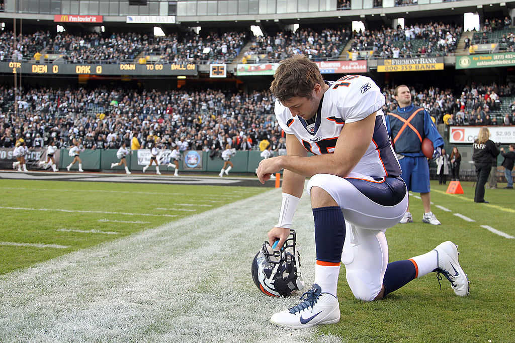 Back in 2011: Tim Tebow prays before s game against the Oakland Raiders (Photo credit: Ezra Shaw/Getty Images)