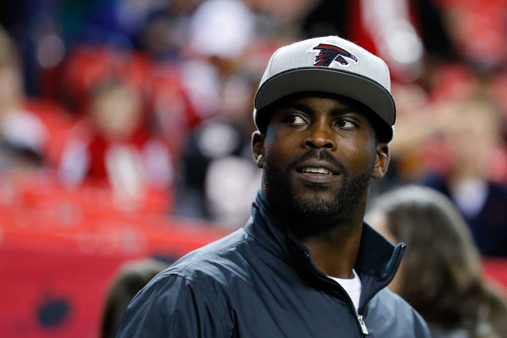 ATLANTA, GA - JANUARY 01: Former Atlanta Falcons player Michael Vick walks on the field prior to the game against the New Orleans Saints at the Georgia Dome on January 1, 2017 in Atlanta, Georgia. (Photo by Kevin C. Cox/Getty Images)