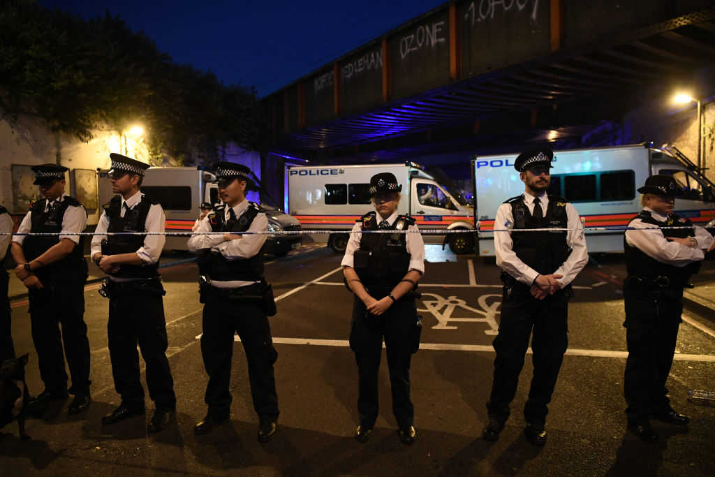 Police officers guard a road leading to Finsbury Park Mosque after an incident in which a van hit worshippers outside the building on June 19, 2017 in London, England. According to reports, worshippers were struck as they were leaving a mosque in North London after Ramadan prayers. (Carl Court/Getty Images)