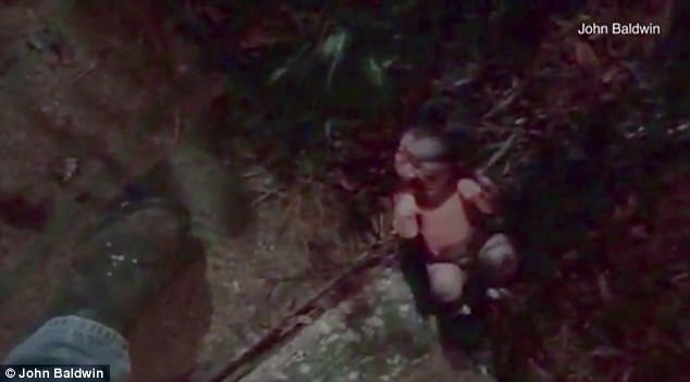 An screen grab from the video that shows the newborn abandoned in a flowerbed. (Photo Credit: James Baldwin)