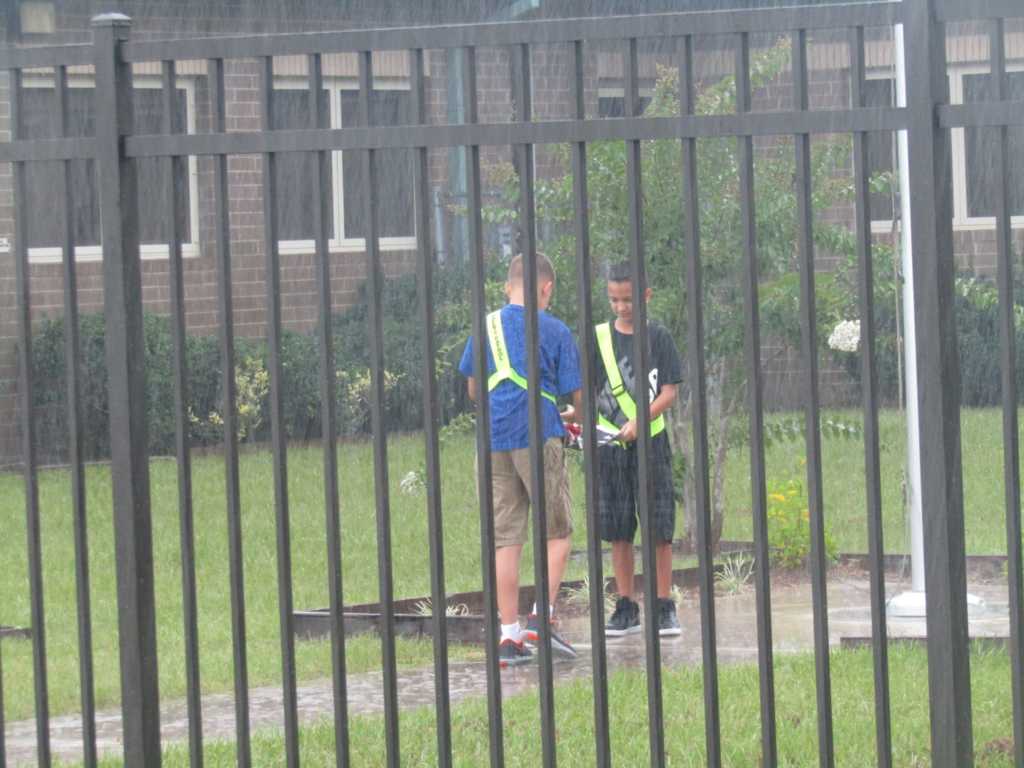 Students Nate and Isaac folding the flag. (Photo Credit: Coppergate Elementary School/Facebook)