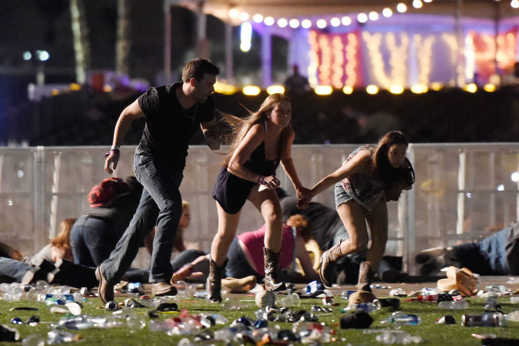 People run from the Route 91 Harvest country music festival after apparent gun fire was hear on October 1, 2017 in Las Vegas, Nevada. (David Becker/Getty Images)