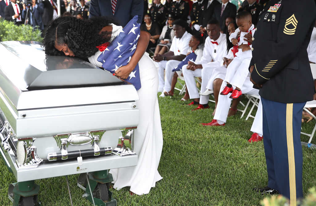 Myeshia Johnson kisses the casket of her husband U.S. Army Sgt. La David Johnson during his burial service at the Memorial Gardens East cemetery on October 21, 2017 in Hollywood, Florida. Sgt. Johnson and three other American soldiers were killed in an ambush in Niger on Oct. 4. (Joe Raedle/Getty Images)