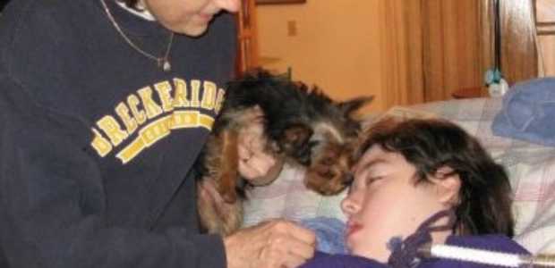 Robbie Kramer (left) with her son, Keith, and their family dog in 2010. (Photo credit: Robbie Kramer)