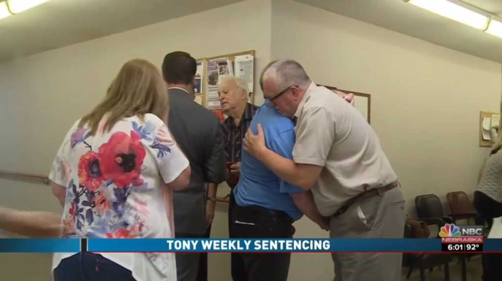 Grandfather and father of the deceased, Rick Pals, hugs the man who killed his family members. Image source: Screenshot/NBC Nebraska