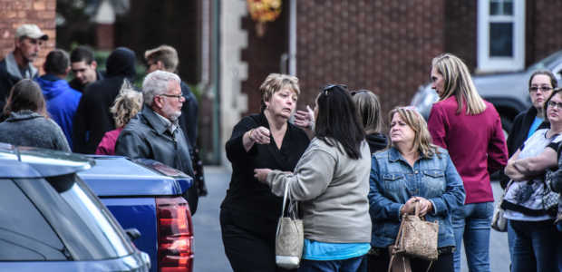 Mourners grieve after leaving a service at St. Stanislaus Roman Catholic Church for some of the victims in last weekend's fatal limo crash on October 12, 2018 in Amsterdam, New York. (Photo by Stephanie Keith/Getty Images)