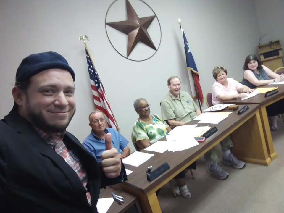 Pro-life campaigner Mark Lee Dickson with council members in Omaha, Texas.
