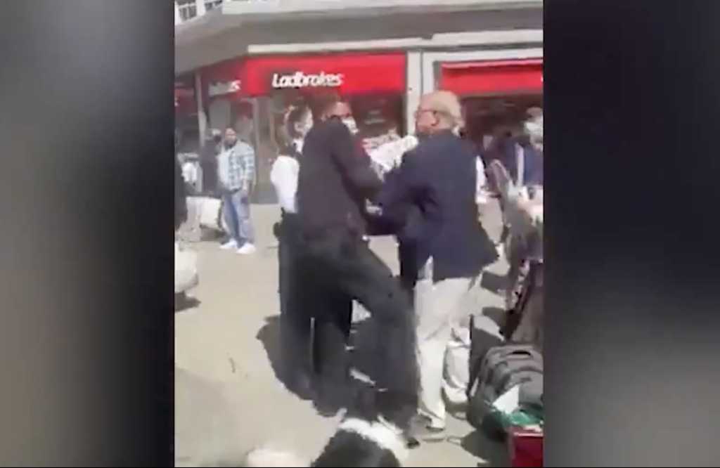 A screenshot from the video of Pastor John Sherwood's arrest by police in northwest London on Friday. Sherwood can be seen in the middle of the image. (Screenshot credit: Christian Concern)